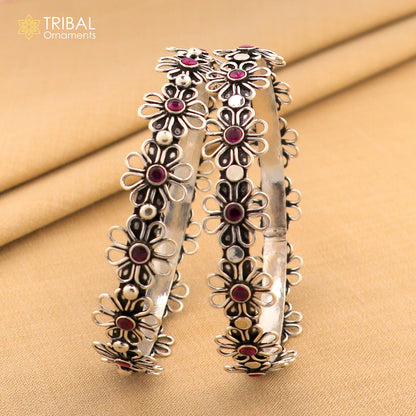 925 sterling silver bangle bracelet with red stone flower design by TRIBAL ORNAMENTS, showcasing intricate jewelry craftsmanship.