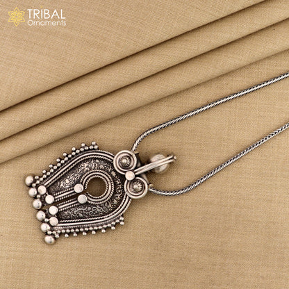 925 sterling silver tribal pendant with antique chitai work, featuring intricate tribal design and a polished, elegant finish.