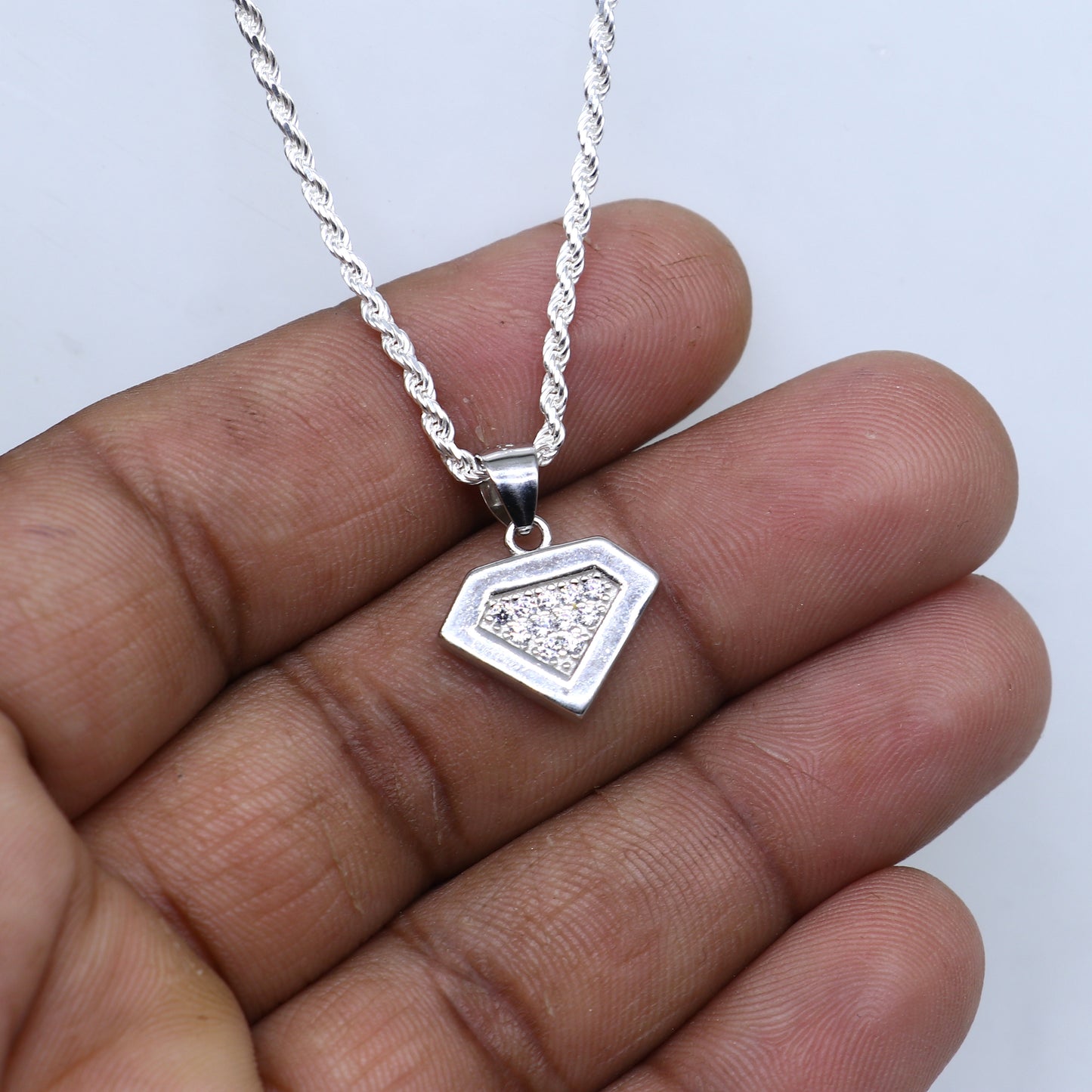 925 Sterling silver pendant set with sparkling cubic zirconia stones, featuring a tribal-inspired design by TRIBAL ORNAMENTS.