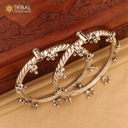 Sterling silver ankle kada with hanging bells and stylish design, featuring intricate tribal ornament details for elegant foot jewelry.