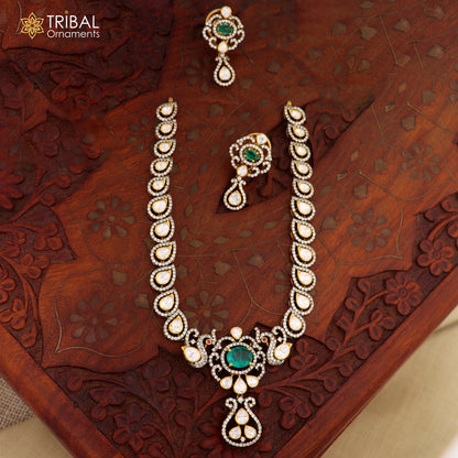 Sterling silver tribal ornament jewelry set featuring white kundan stone and polki charm necklace and matching earrings.
