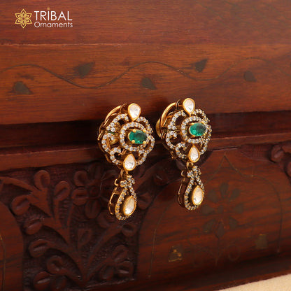 Sterling silver tribal jewelry set with white kundan stone and polki charms, featuring a necklace and matching earrings.