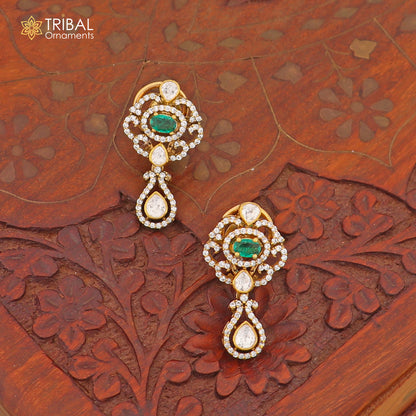 Sterling silver tribal jewelry set with white kundan stone and polki charms, featuring a necklace and matching earrings.