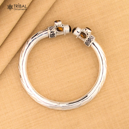 Unisex 925 sterling silver bangle bracelet with tiger eye stone, featuring a sleek design and customizable jewelry by Tribal Ornaments.