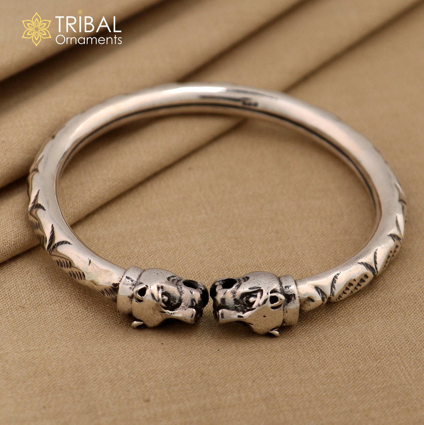 Sterling silver lion face kada bracelet by TRIBAL ORNAMENTS, featuring tribal-inspired stylish bangle with intricate pretty work.