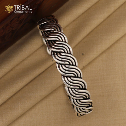 Sterling silver twisted open face adjustable bangle bracelet with tribal design by TRIBAL ORNAMENTS