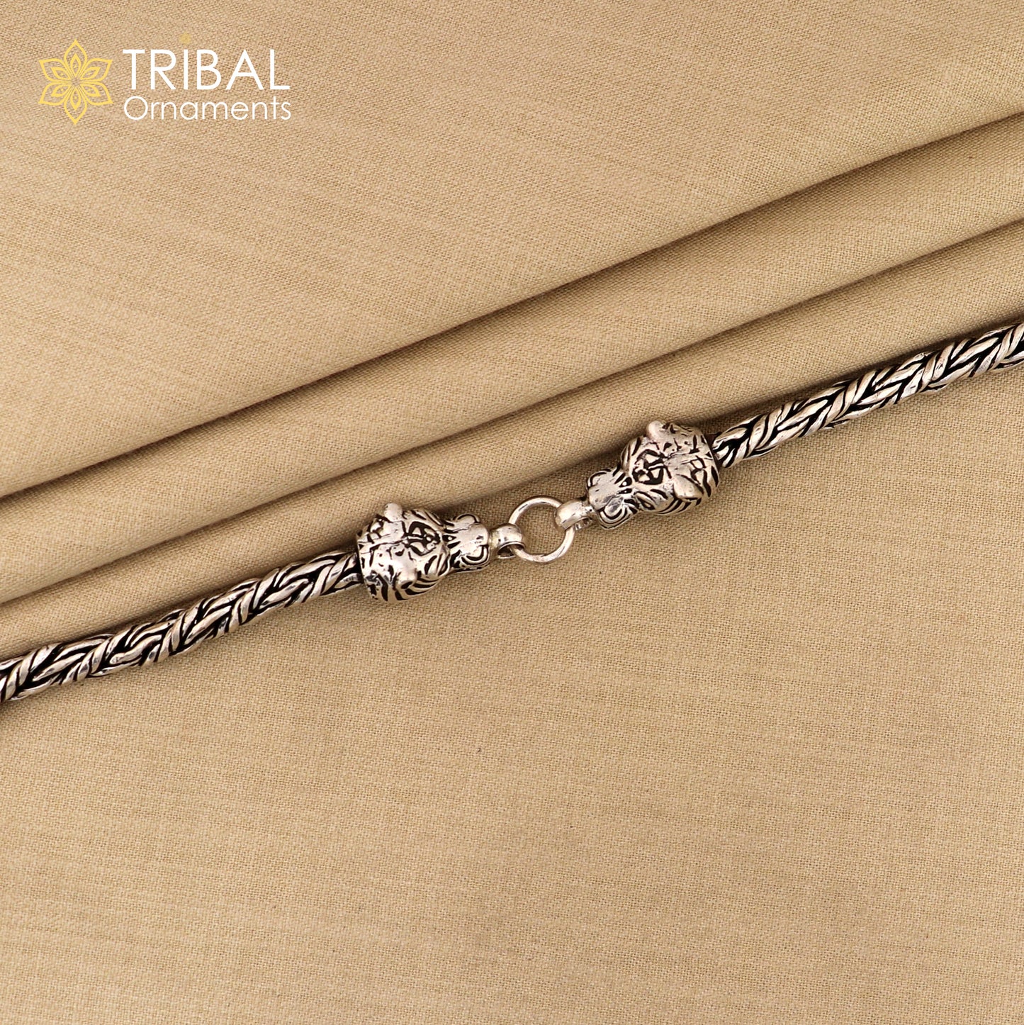 Sterling silver chain bracelet with lion face design by TRIBAL ORNAMENTS, stylish jewelry perfect for gifting.