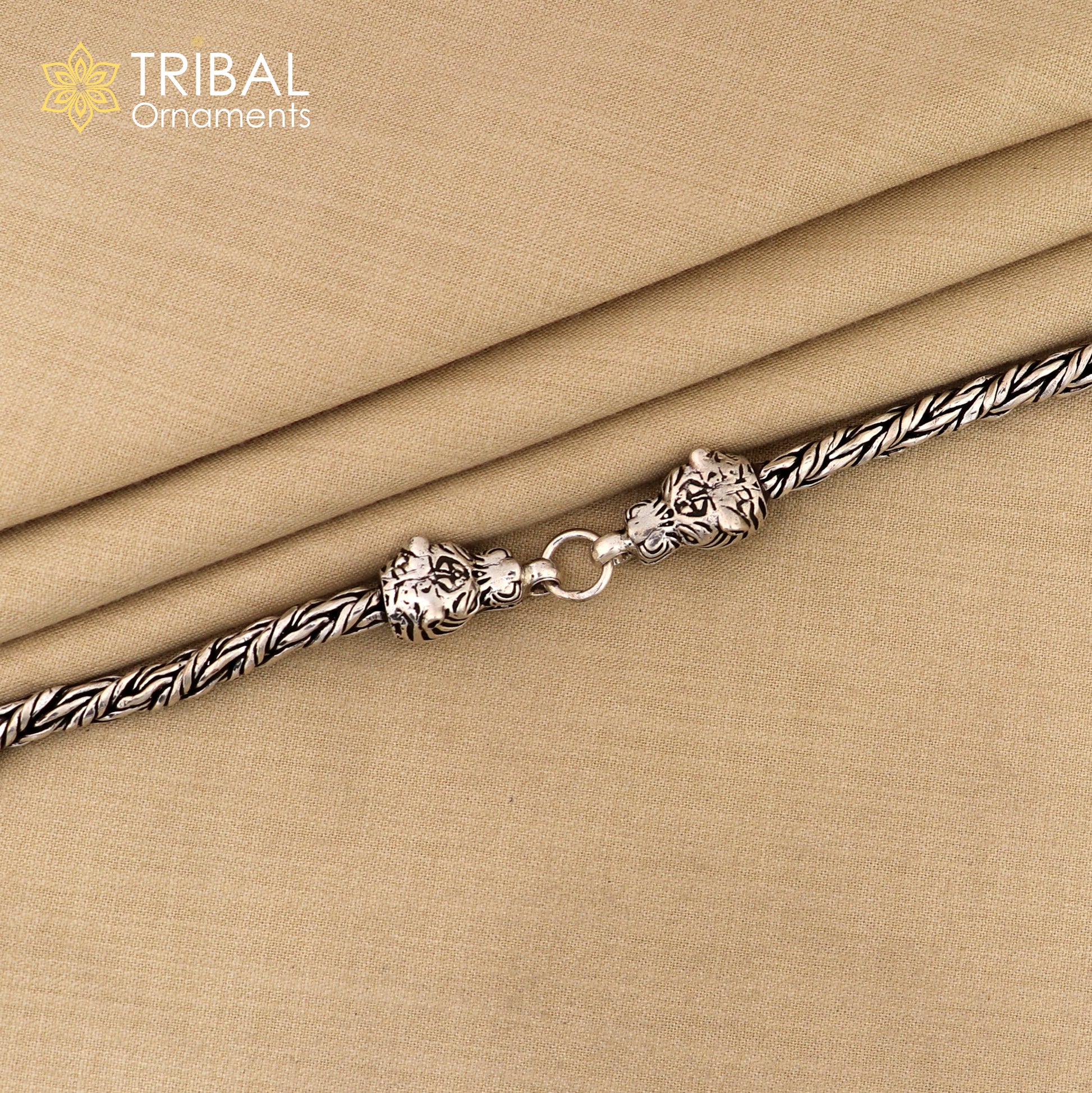 Sterling silver chain bracelet with lion face design by TRIBAL ORNAMENTS, stylish jewelry perfect for gifting.