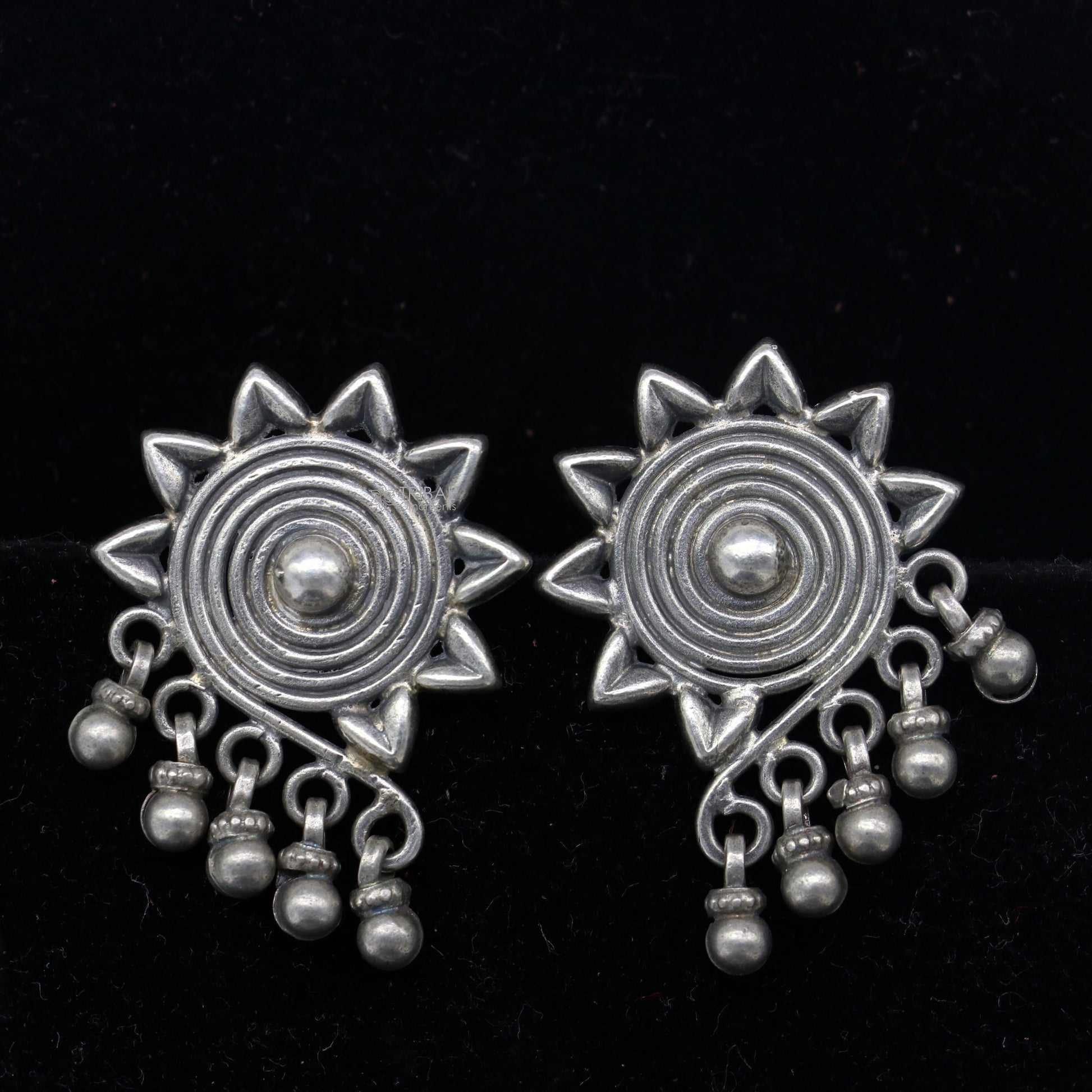 925 sterling silver floral design stud earrings by TRIBAL ORNAMENTS, ethnic bridal jewelry with intricate work and traditional style.