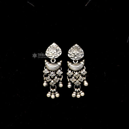 925 silver floral design stud earrings with hanging drop dangle, crafted by TRIBAL ORNAMENTS, detailed floral pattern.