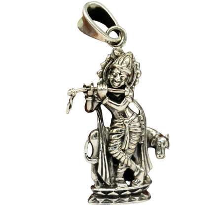 Sterling silver Krishna with cow pendant jewelry from TRIBAL ORNAMENTS, featuring intricate vintage Hindu idol design.
