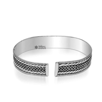Vintage 925 sterling silver handmade bangle cuff bracelet with intricate tribal design by TRIBAL ORNAMENTS