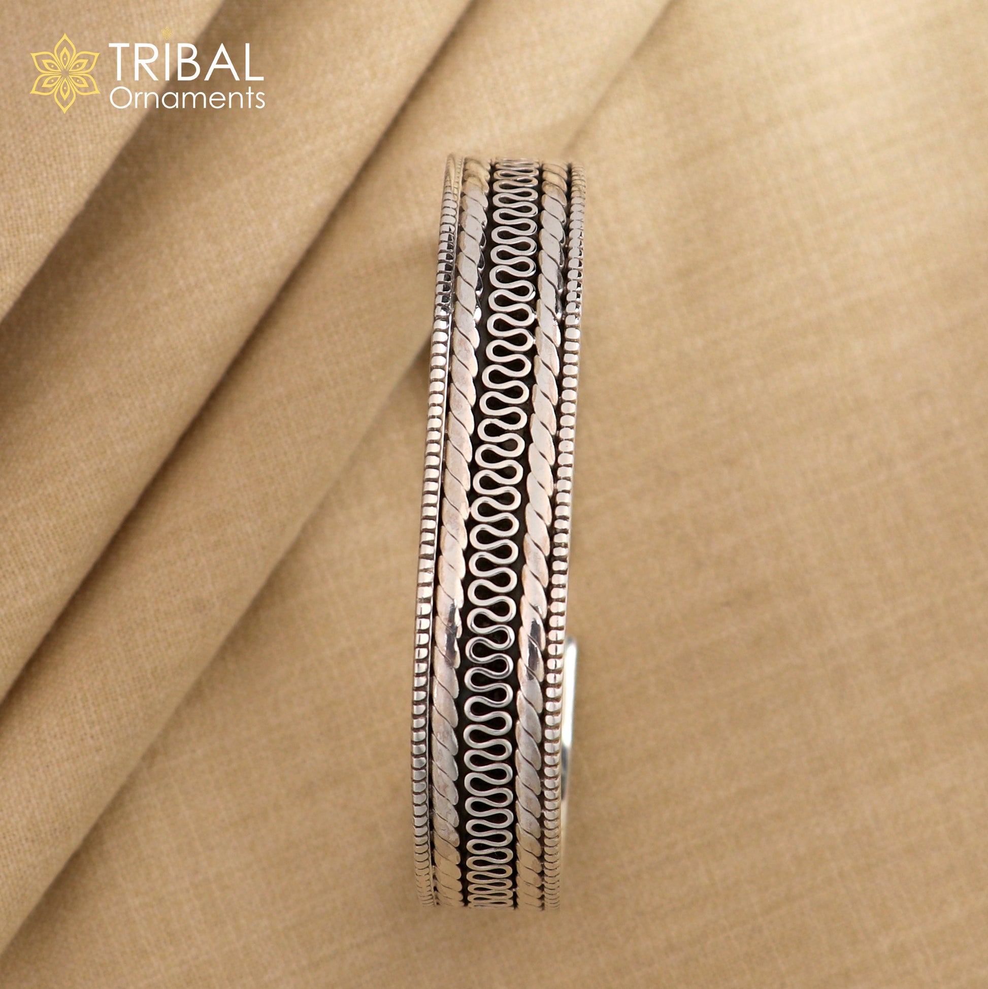 Vintage-style 925 sterling silver handmade bangle cuff bracelet with intricate tribal design by TRIBAL ORNAMENTS.