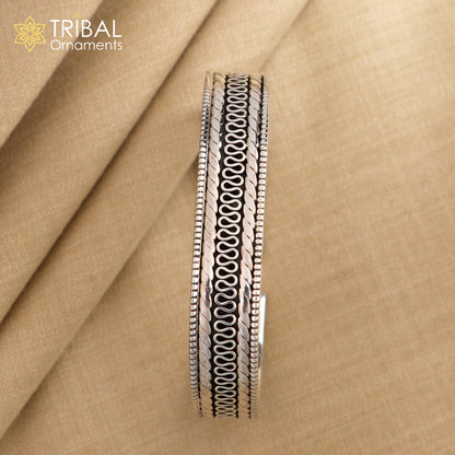 Vintage-style 925 sterling silver handmade bangle cuff bracelet with intricate tribal design by TRIBAL ORNAMENTS.