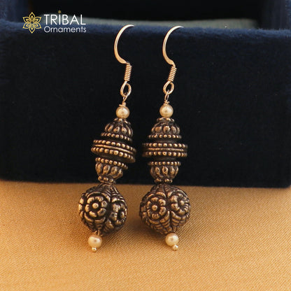 Sterling silver vintage flower design hoops earrings by TRIBAL ORNAMENTS, featuring tribal ethnic jewelry style and intricate floral details.
