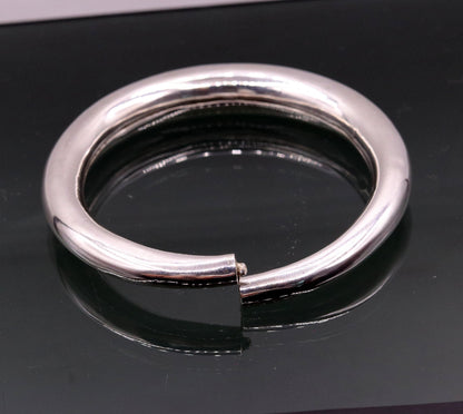 Sterling silver vintage open-face adjustable bangle bracelet by TRIBAL ORNAMENTS, unisex handmade cuff with plain design.