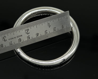 Sterling silver vintage open face bangle bracelet by Tribal Ornaments, handmade, adjustable unisex cuff jewelry for gifting in India.