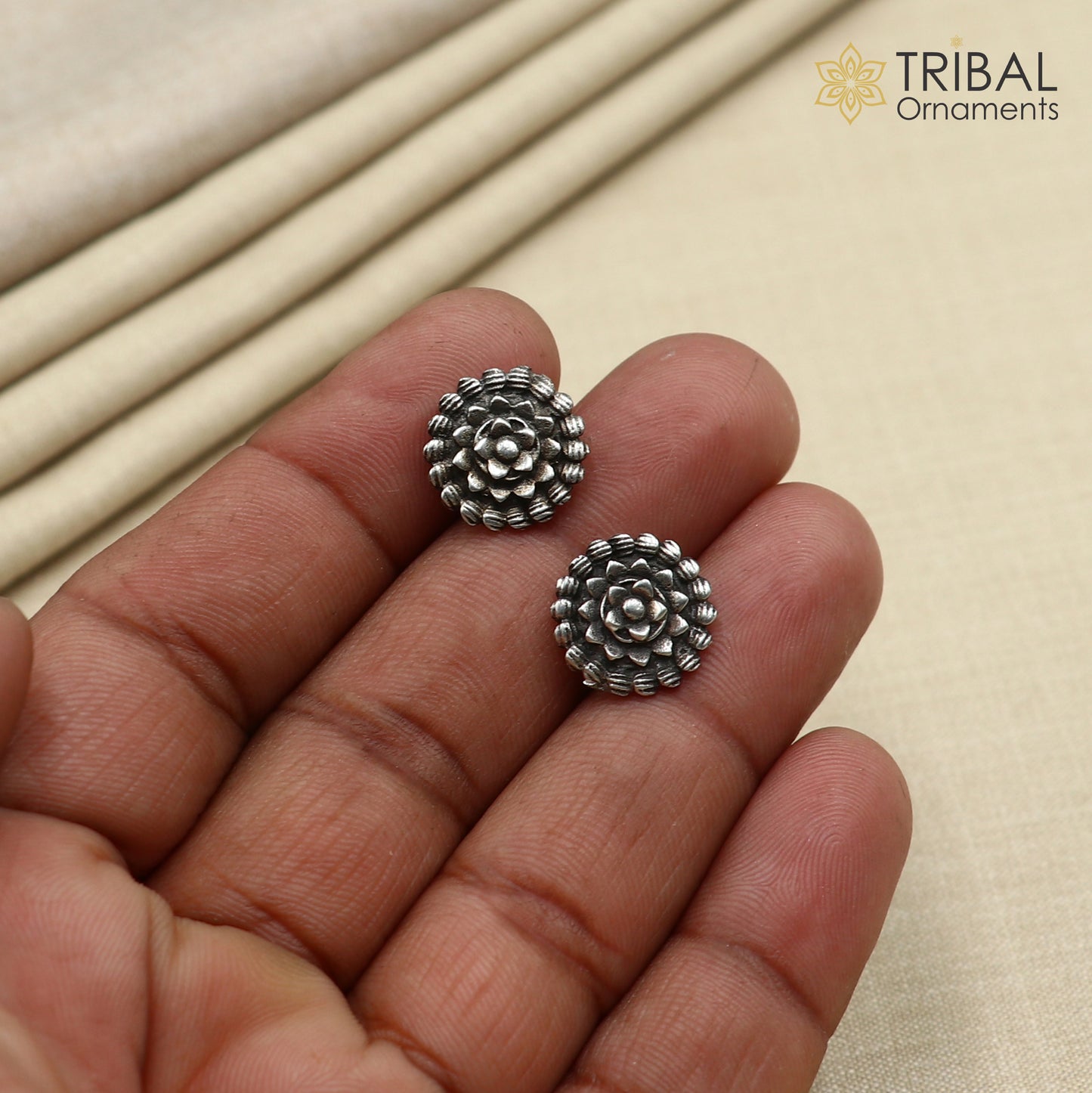 Vintage style flower design sterling silver stud earring by TRIBAL ORNAMENTS featuring intricate ethnic flower motifs.
