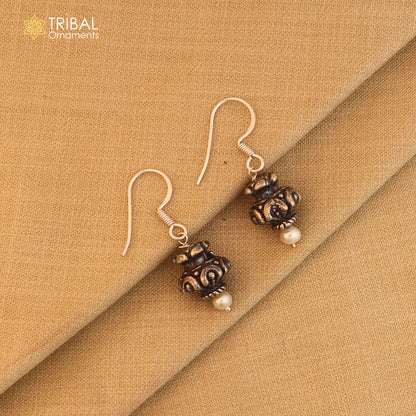 Sterling silver vintage tribal hoop earrings with stylish ethnic design, showcasing intricate patterns and craftsmanship.