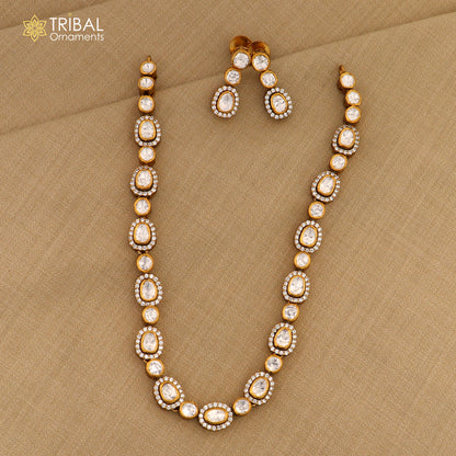 925 sterling silver jewelry set with white kundan and polki stones, featuring a charm necklace and matching earrings, stylish tribal design