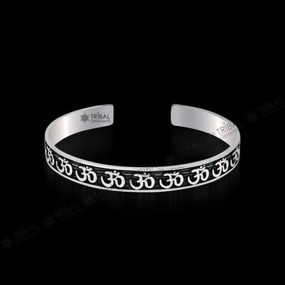 Sterling silver 'AUM' mantra adjustable bangle cuff from Tribal Ornaments, unisex handcrafted jewelry with divine, stylish design.