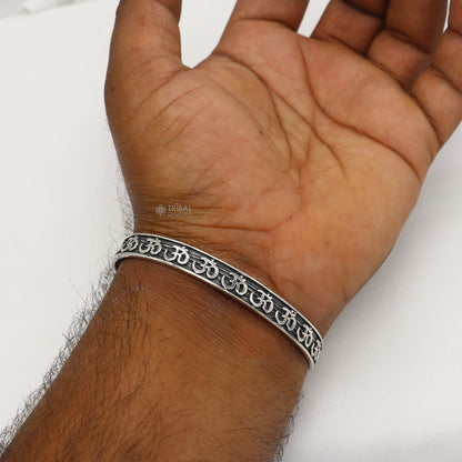 Sterling silver 'AUM' mantra adjustable unisex bangle cuff bracelet by Tribal Ornaments, handcrafted stylish jewelry.