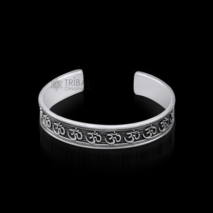 Stylish handcrafted 925 sterling silver 'AUM' mantra cuff bangle bracelet, adjustable unisex jewelry with ethnic tribal design.