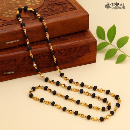 Sterling silver handmade basil rosary beads with wooden beads on a silver chain over gold polished, black tulsi mala necklace.