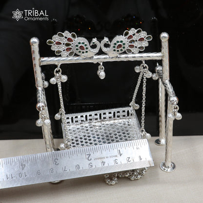 Sterling silver peacock design Bal Gopala jhula featuring Little Krishna swing, child Krishna Palana art by TRIBAL ORNAMENTS.