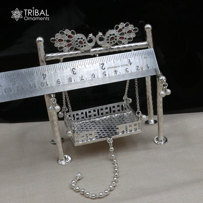 Sterling silver peacock design Bal Gopala Krishna swing pendant with detailed child Krishna Palana art, crafted by TRIBAL ORNAMENTS.