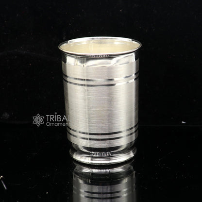Handmade 999 pure fine silver water and milk cup tumbler with 75ml capacity, featuring intricate tribal ornament designs.
