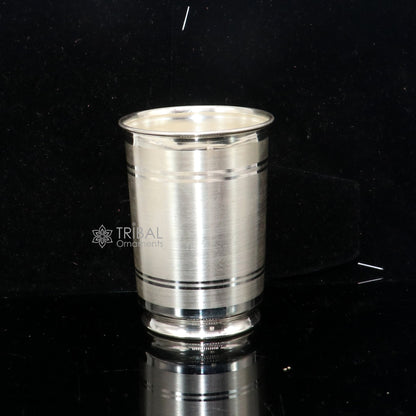 Handmade 999 pure fine silver water and milk cup tumbler with 75ml capacity, featuring intricate tribal ornament design.