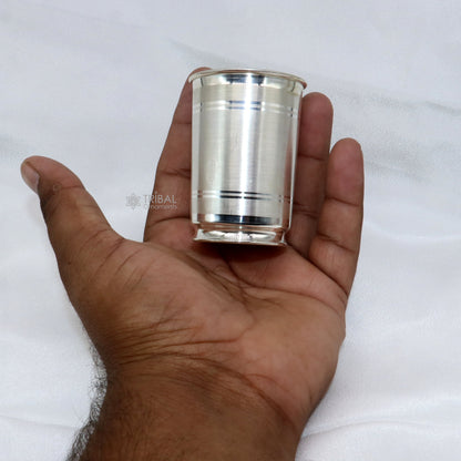Handmade 999 pure fine silver water and milk cup tumbler with 75ML capacity, featuring intricate tribal ornament designs.