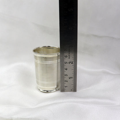 Handmade 999 pure fine silver water and milk cup tumbler with 75ML capacity, featuring intricate tribal ornament design.