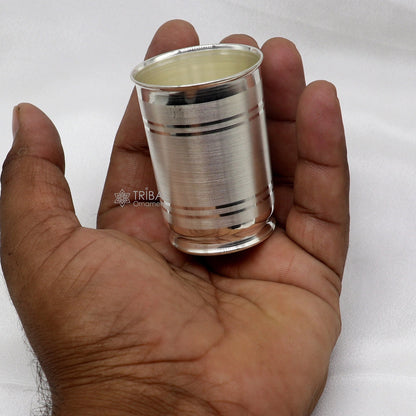 Handmade 999 pure fine silver water and milk cup tumbler with 75ML capacity, featuring intricate tribal ornament designs.