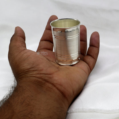 Handmade 999 pure fine silver water and milk cup tumbler with 75ML capacity, featuring intricate tribal ornament designs.