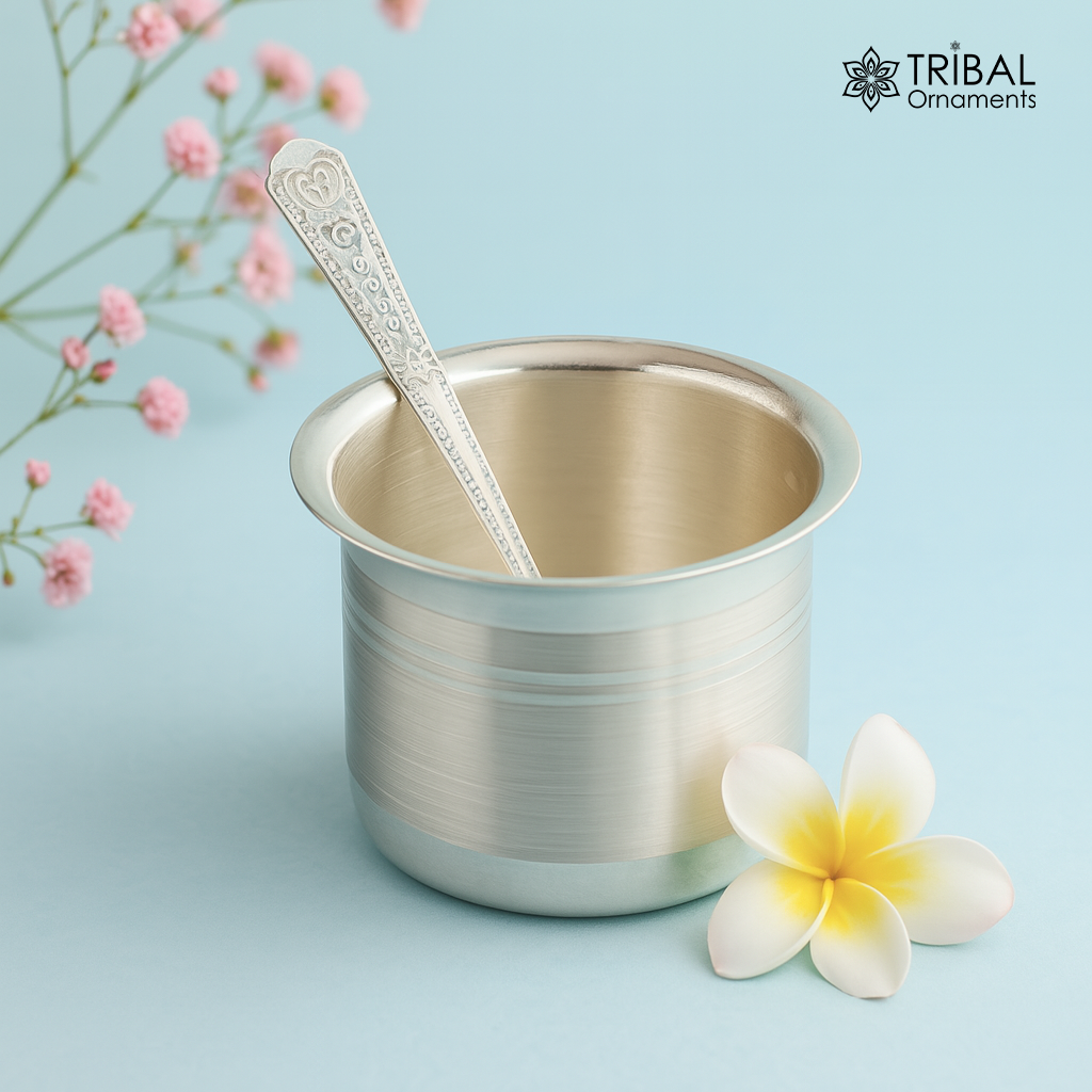 999 pure silver baby feeding set with bowl and spoon, handmade by TRIBAL ORNAMENTS, featuring solid silver vessels and utensils.