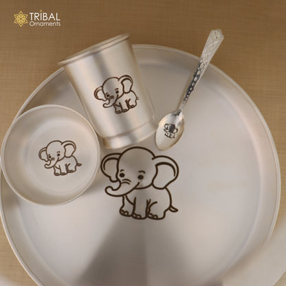 Silver baby dinner set by Tribal Ornaments including a bowl, spoon, tumbler, and plate in 999 silver.