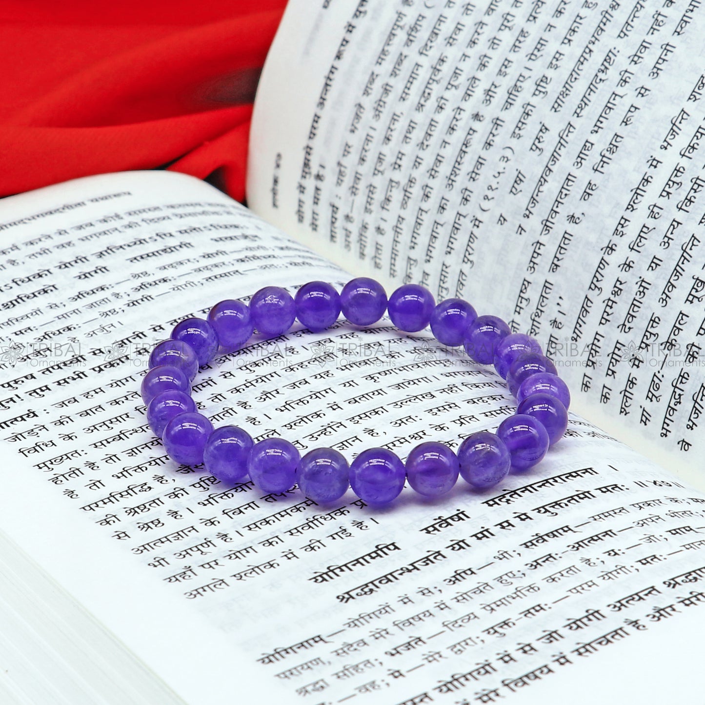 Amethyst bracelet by Tribal Ornaments featuring polished purple stones, designed to promote calm and clarity.