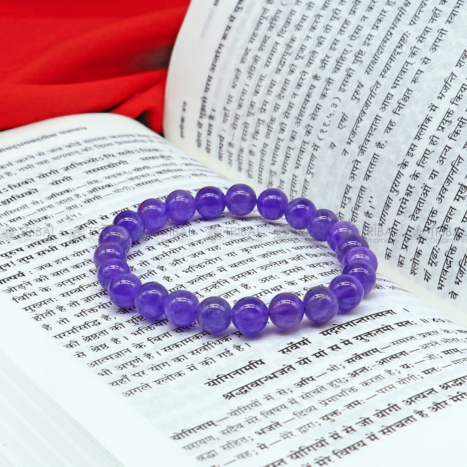 Amethyst bracelet by Tribal Ornaments featuring polished purple stones, designed to promote calm and clarity.
