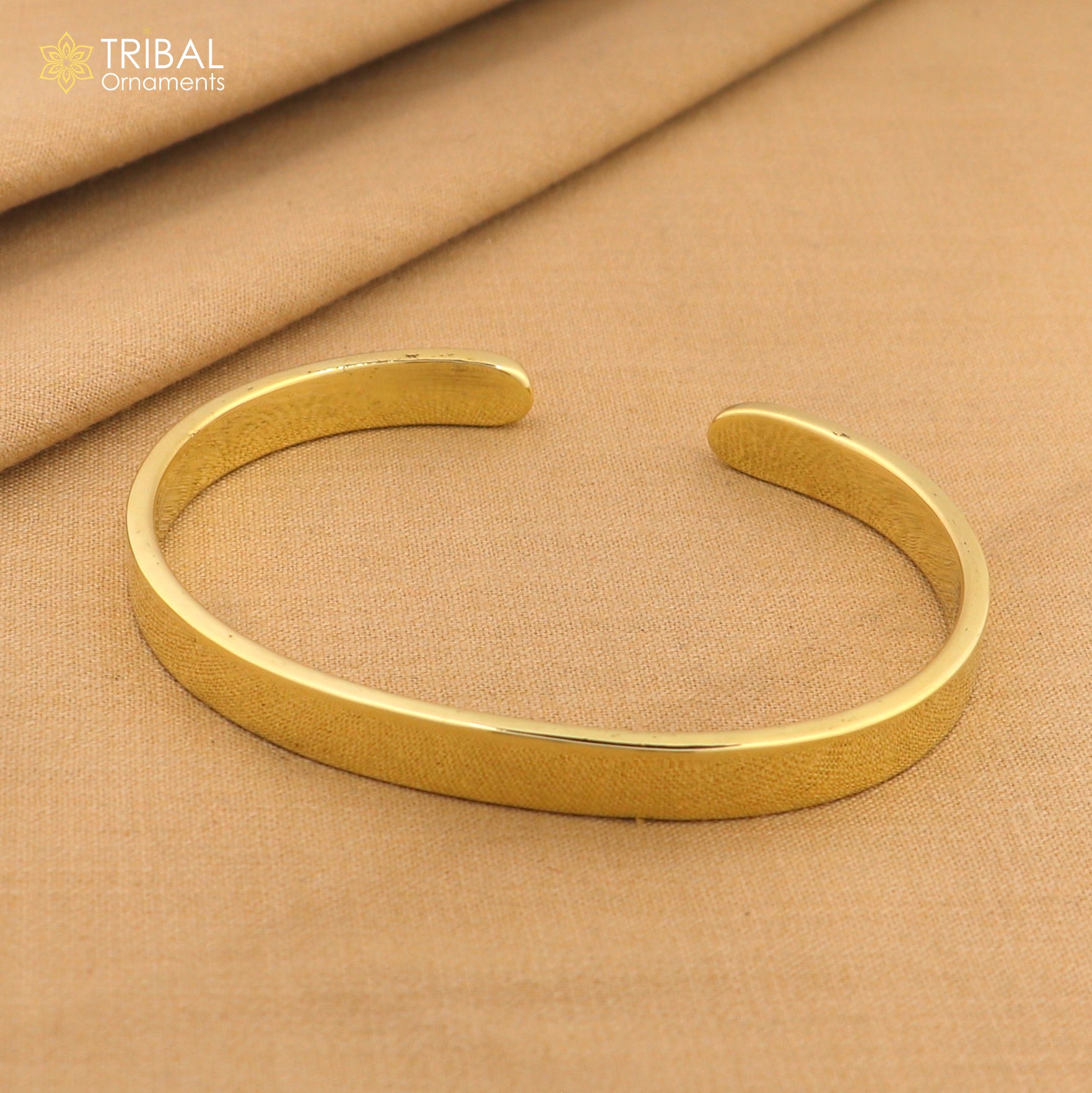 Plain shiny Ashtdhatu cuff bracelet by TRIBAL ORNAMENTS, unisex jewelry cuff with a sleek, minimalist design.