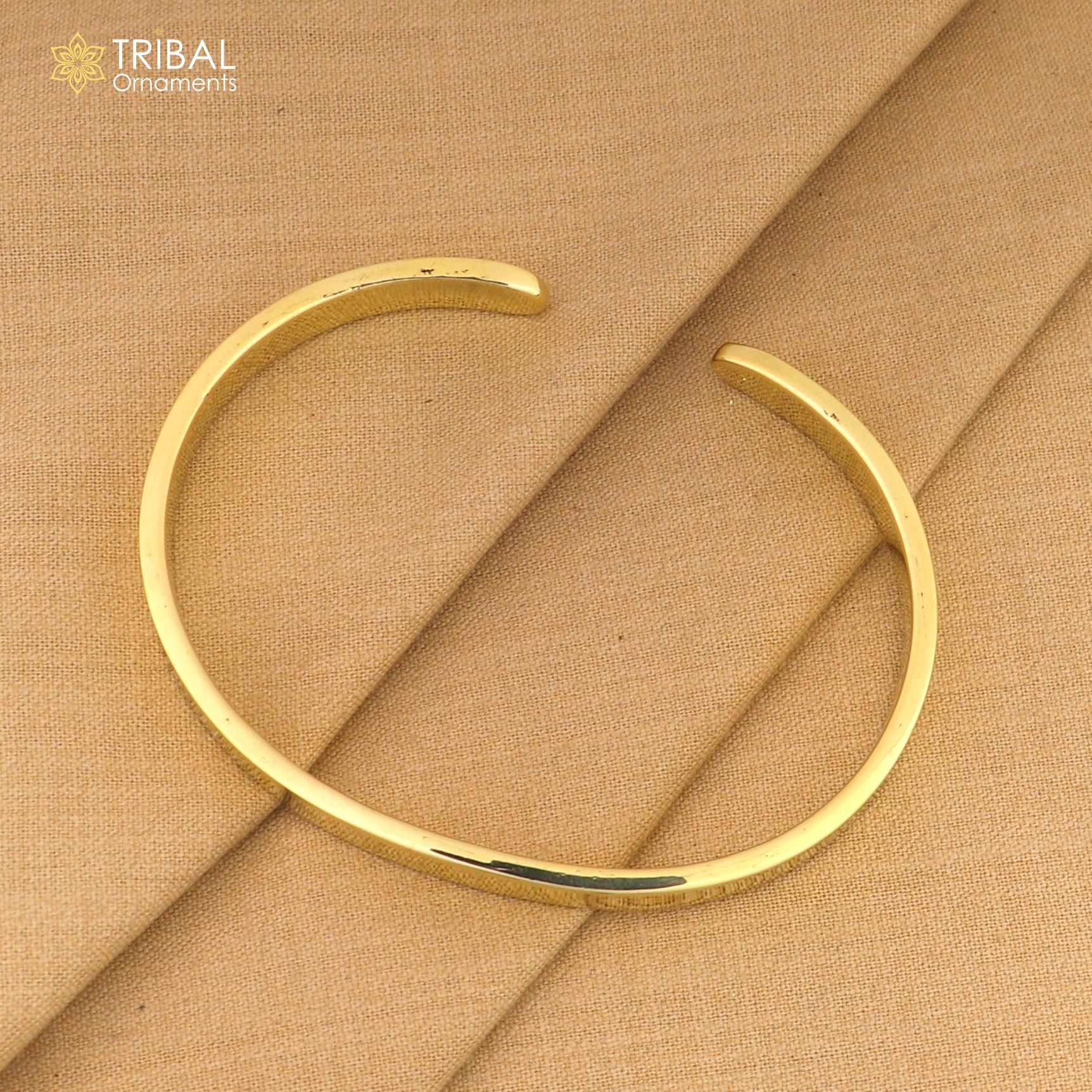 Shiny plain Ashtdhatu cuff kada bracelet by Tribal Ornaments, unisex jewelry with a sleek, polished design.