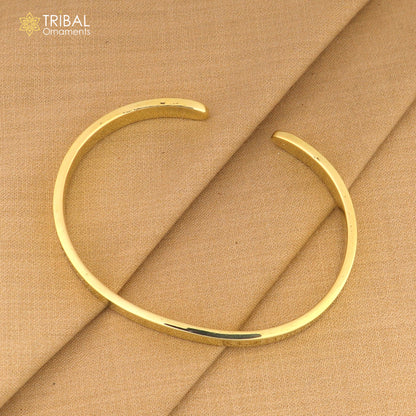 Shiny plain Ashtdhatu cuff kada bracelet by Tribal Ornaments, unisex jewelry with a sleek, polished design.