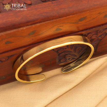 Shiny plain Ashtdhatu cuff kada bracelet by Tribal Ornaments, unisex jewelry with a sleek, polished finish.