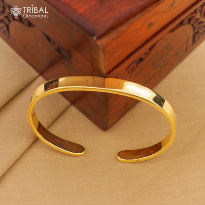 Plain shiny Ashtdhatu cuff bracelet from TRIBAL ORNAMENTS, unisex jewelry cuff with a sleek, minimalist design.