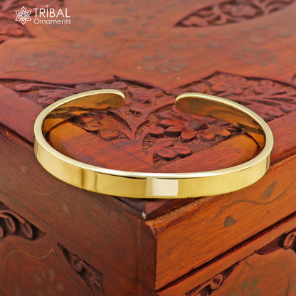 Plain shiny Ashtdhatu cuff bracelet by TRIBAL ORNAMENTS, unisex jewelry cuff with smooth finish, ideal for everyday wear.