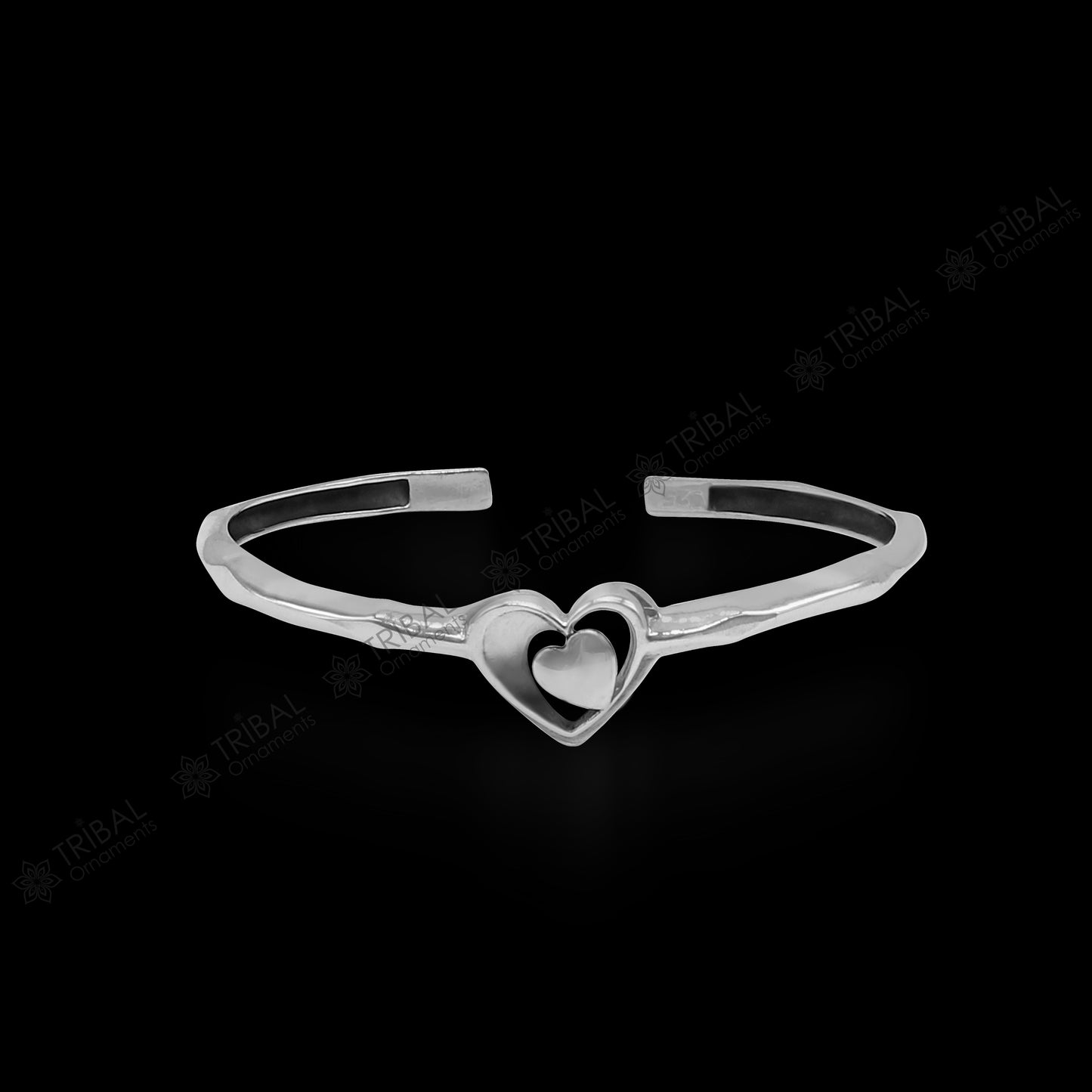 925 sterling silver heart design bangle cuff bracelet by TRIBAL ORNAMENTS, featuring an adjustable, handmade jewelry cuff with intricate details.