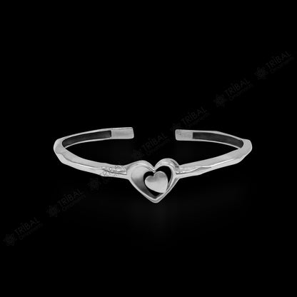 925 sterling silver heart design bangle cuff bracelet by TRIBAL ORNAMENTS, featuring an adjustable, handmade jewelry cuff with intricate details.