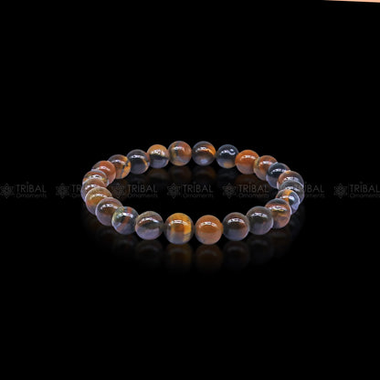 Brown Tiger Eye bracelet by TRIBAL ORNAMENTS featuring polished beads that symbolize strength and confidence.
