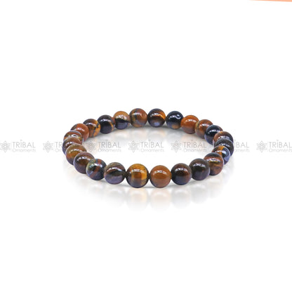 Brown Tiger Eye bracelet by TRIBAL ORNAMENTS featuring polished stones symbolizing strength and confidence.
